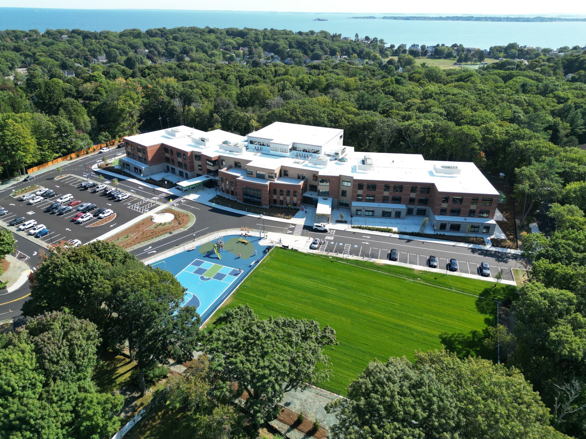 Birds eye view of the Swampscott Elementary School Campus showing ocean in background