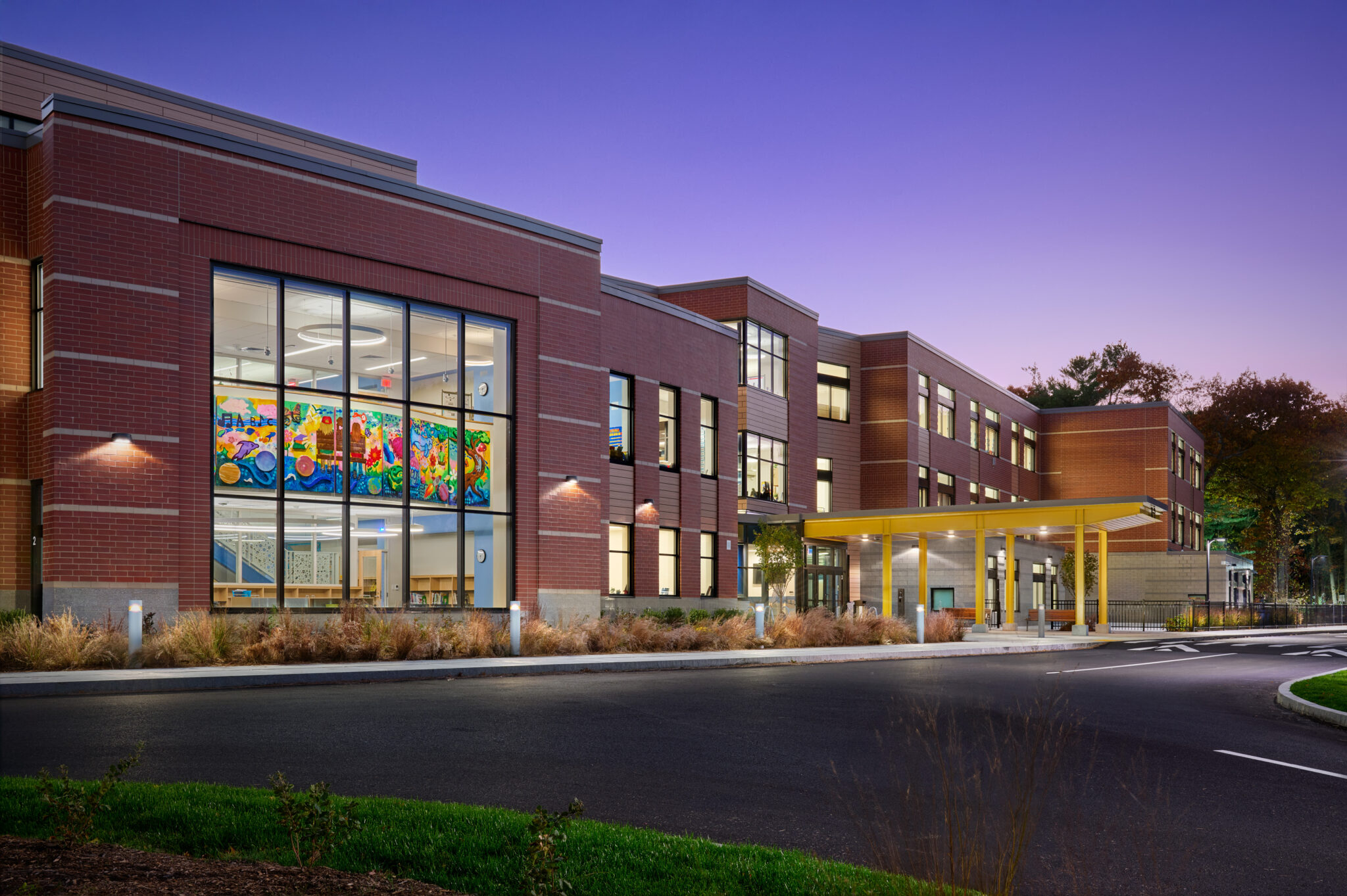 Swampscott Elementary School with purple dusk sky behind it